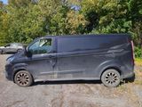 a van that has been vandalized in a parking lot