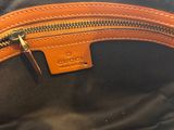the inside of a brown and black bag with a zipper on it