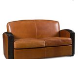 a brown leather couch with black legs and a black frame