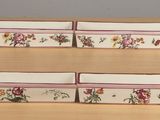 a picture of a belt with flowers on it on a table