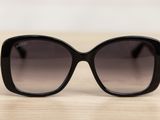 a close up of a pair of sunglasses on a table