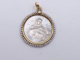 a gold and silver pendant with a mother and child in the center