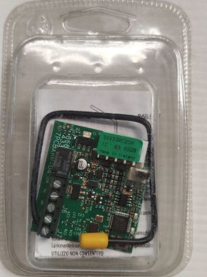 a close up of a small electronic device in a plastic container