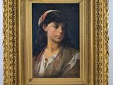 portrait of a young woman in a red headband by a gold frame
