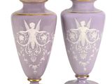 pair of purple vases with white designs on them on a white background