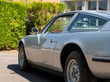 a silver car parked on the side of the road