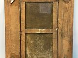 an old wooden picture frame with a glass window on a white background
