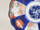 a blue and white plate with a design on it