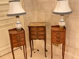 two lamps that are sitting on a table in a room