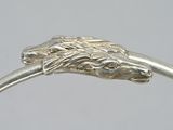 silver ring with a lion head on the side of it