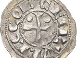 Gros plan sur une pièce de monnaie portant une croix