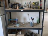 a shelf that has many items on it in the kitchen