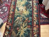 a rug on the floor with a picture of a bird on it
