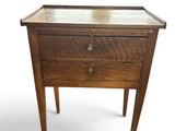 an image of a small table with a drawer on it