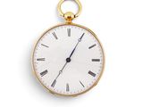 une montre de poche en or avec des chiffres romains sur le cadran