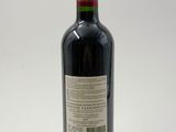a bottle of wine that is sitting on a table