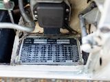 a close up of a car ' s engine with a control panel