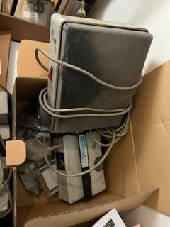 a box full of electronics and a remote in it