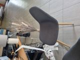 a picture of a chair with a broom on top of it