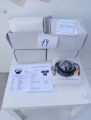 a white table with a bunch of boxes and papers on it