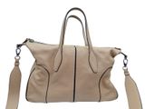 a close up of a handbag with a strap on a white background
