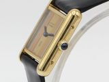 a close up of a wrist watch with a black leather band