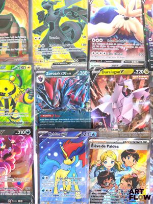 a lot of pokemon cards that are on the table
