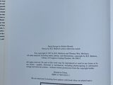 a book open to a page with a picture of a cat on it