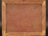 an old wooden easel with a painting on it on a black background