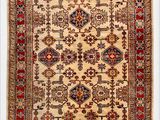 an antique persian rug with a white background and a red border
