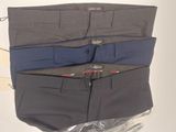 three men ' s pants are lined up on a plastic bag
