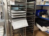 many trays of food on the shelves in the kitchen