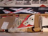 a cardboard box with a model of a plane inside of it