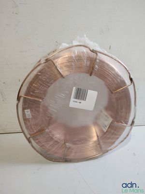 a roll of copper wire wrapped in plastic on a table