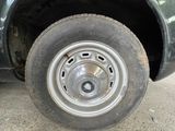 a close up of a flat tire on a truck
