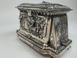 a silver box sitting on top of a white table