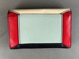 a close up of a small wallet with a red, white and blue stripe