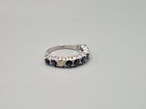 a close up of a ring on a table with a white background