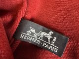 a close up of a red shirt with a label on it