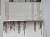 a newspaper with a picture of a man in a car