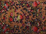 a large rug with a pattern on it in a room