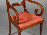 an image of a chair with a red seat and a wooden frame