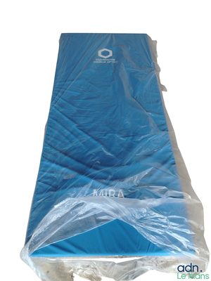 a blue mattress that is wrapped in plastic