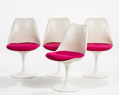 three white tulip chairs with pink cushions on a white surface