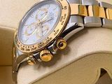 a watch that is sitting on top of a pillow