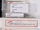 a lot of different types of screws in a box