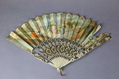 a fan with a design on it on a gray surface