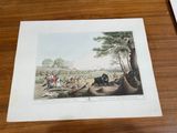 a picture of a picture of a hunting scene on a table