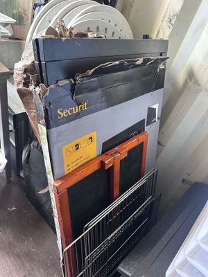 a stack of old appliances in the back of a truck