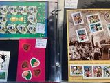 many different types of stamps on display on a table